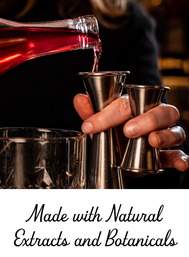 Red liquid being poured from a bottle into metal jiggers held by a hand, with text 'Made with Natural Extracts and Botanicals' below.